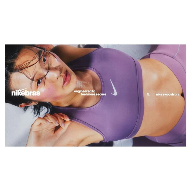 Woman in purple Nike sports bra and leggings, laying down, studio shot. Fitness and fashion apparel advertisement, close up shot.