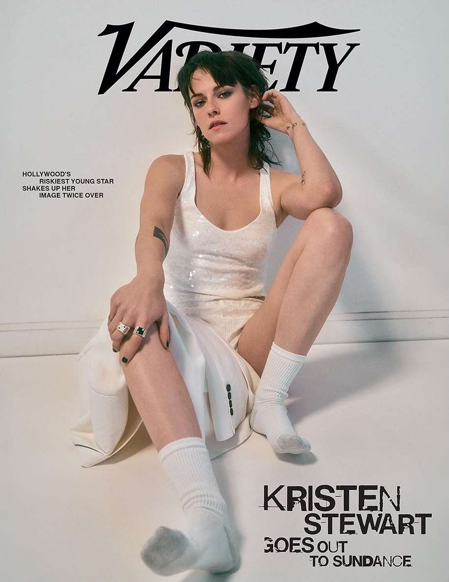 Magazine cover featuring Kristen Stewart, seated in a white sequin dress and socks, with Variety logo and cover text against a white backdrop.