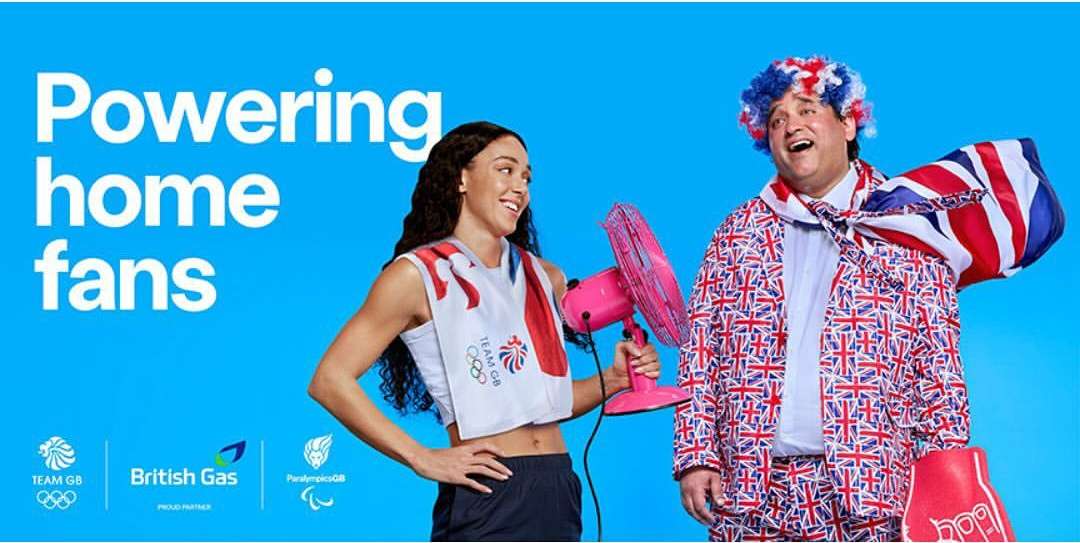 Image of a smiling female athlete holding a pink fan next to a man wearing a Union Jack suit on a bright blue background.