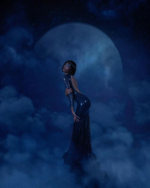 Woman in a long, blue, sparkly dress posing against a blue, cloudy backdrop with a large, bright moon in the background.