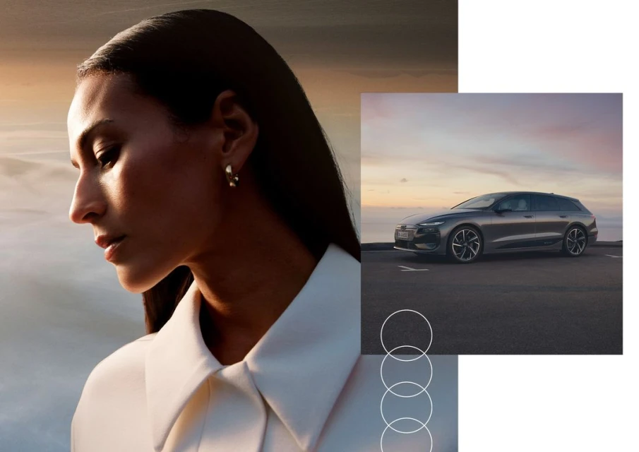Elegant shot featuring an adult woman in a white collared shirt alongside a sleek gray Audi A6 Avant against a backdrop of a vibrant sunset.