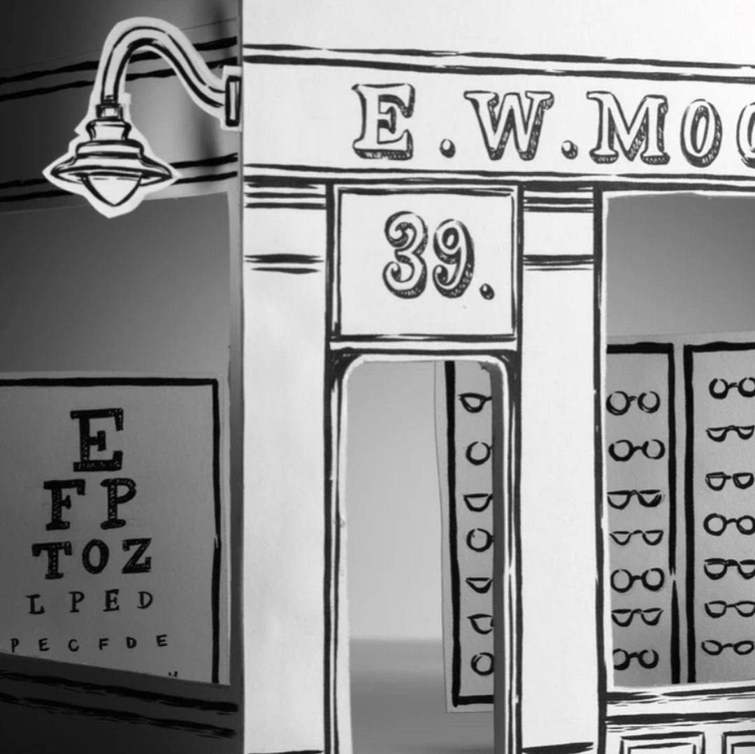 Black and white illustrative image of an optometrist's office with an eye chart and glasses displayed in the shop window, and streetlamp.