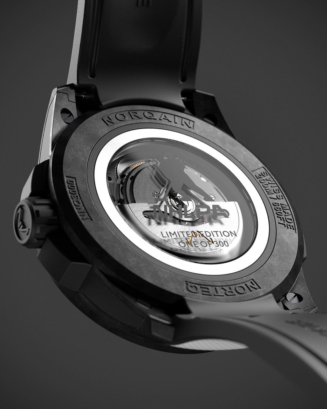 Close-up of a NORQAIN watch featuring a black strap and casing with a clear window revealing the intricate inner workings of the timepiece.