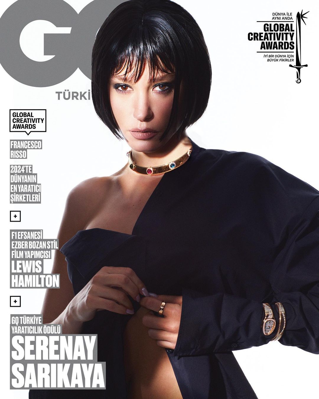 Magazine cover featuring Serenay Sarikaya with a short black bob, gold jewelry, and wearing a dark draped top against a white backdrop.