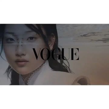 Close-up of an Asian woman wearing a white garment, overlaid with the 'VOGUE' magazine logo against a blurred, neutral-toned background.