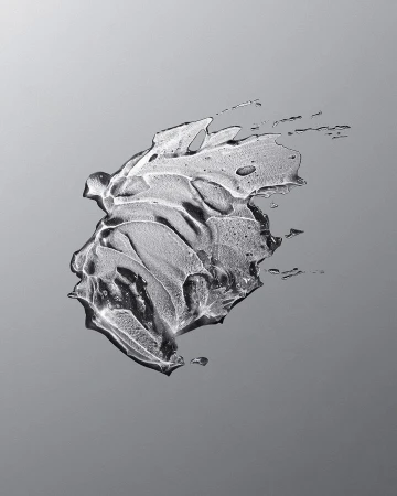 Abstract close-up of a clear gel substance with curved lines and textures on a gray gradient background, product shot, beauty concept.