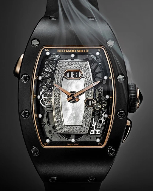 Luxury black and rose gold Richard Mille wristwatch featuring an intricate diamond and pearl face, set against a dark gray background with wisps of smoke.