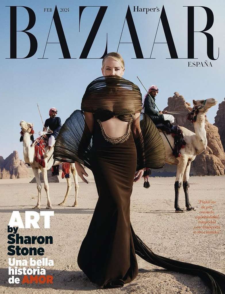 Harper's Bazaar España magazine cover featuring a fashion model in a black gown, camels, and desert landscape under a clear sky.