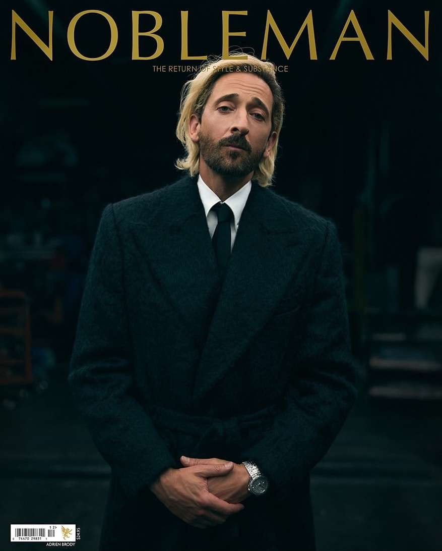 Magazine cover featuring Adrien Brody wearing a dark overcoat and tie. The masthead reads 'NOBLEMAN'.