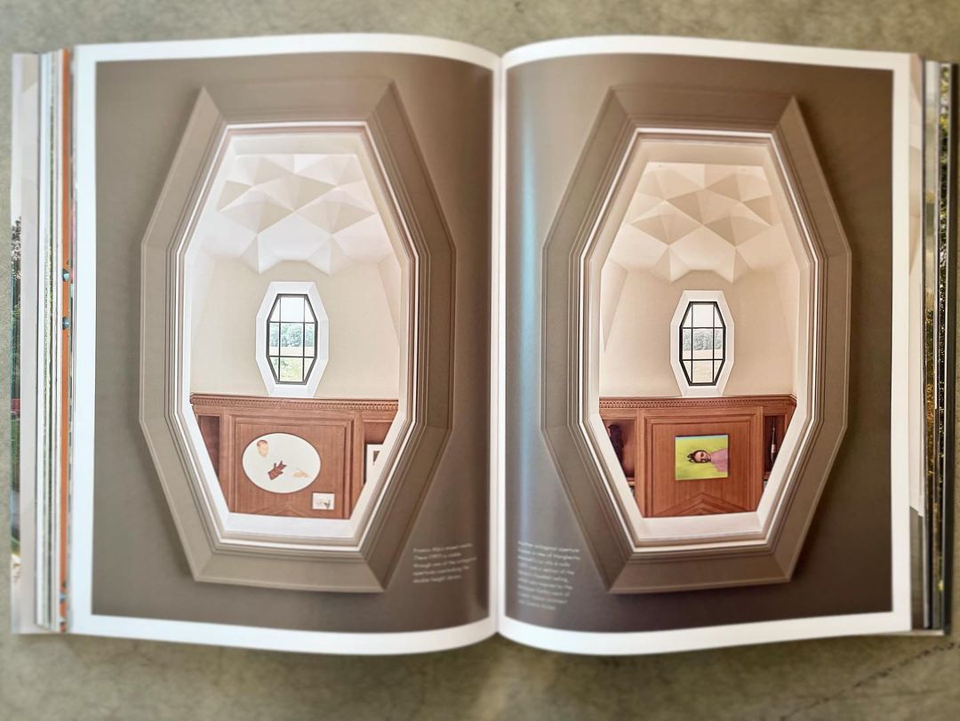 Interior design book double-page spread featuring matching arched niches, wood cabinets, and geometric lighting in a modern home.