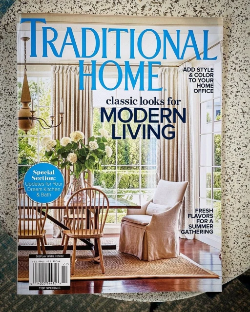 Magazine cover featuring an interior with dining furniture and a chair, promoting modern living and home decor ideas for kitchens, baths, and offices.