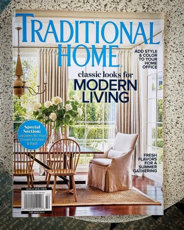 Magazine cover featuring an interior with dining furniture and a chair, promoting modern living and home decor ideas for kitchens, baths, and offices.