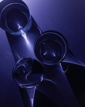 Abstract composition featuring three clear glass spheres casting light reflections against a gradient blue background, emphasizing luminosity.