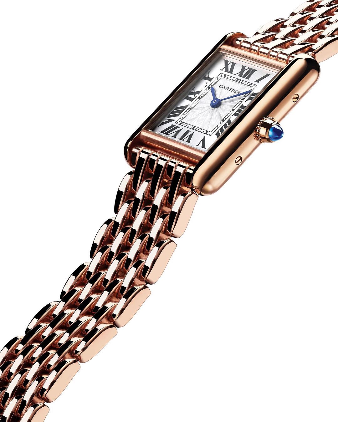 Elegant rose gold Cartier Tank watch with a woven metal bracelet and a white dial featuring Roman numerals. 