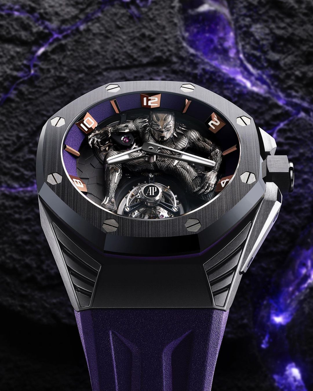 High-angle shot of a Black Panther wristwatch with a purple band against a textured black background, highlighting the watch's design.