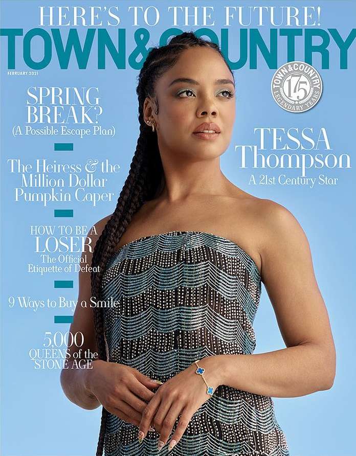 Tessa Thompson on a Town & Country magazine cover; she wears a strapless dress and a butterfly bracelet against a light-blue backdrop.
