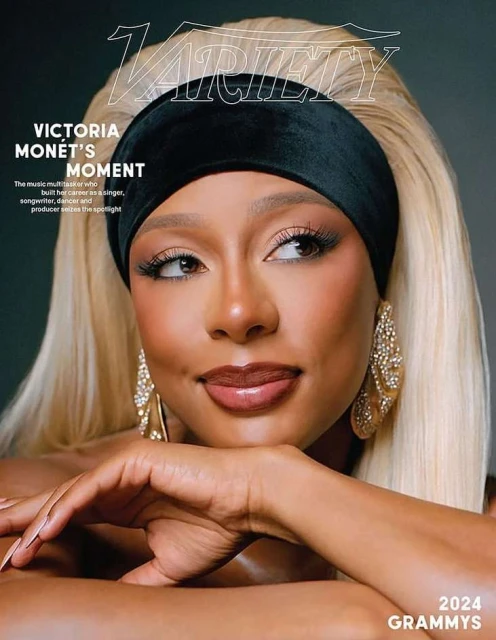 Close-up cover shot of Victoria Monet, musician and Grammy nominee, wearing a black headband and large crystal earrings, posing indoors.