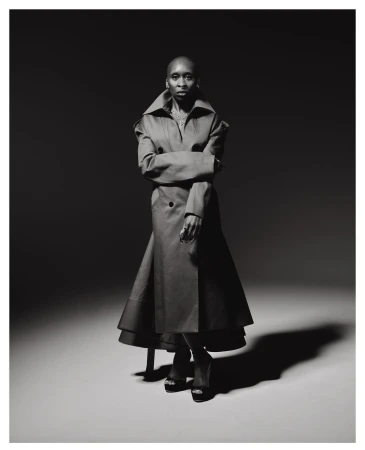 Cynthia Erivo wearing a long double-breasted coat with an oversized collar in a studio portrait by Erik Carter