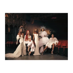 Five models in white haute couture gowns and elaborate headdresses posing inside an ornate theatre by Erik Carter