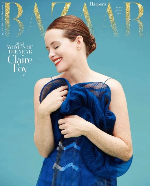 Magazine cover featuring Claire Foy wearing a blue dress, smiling against a light blue background with 'BAZAAR' in gold glitter text.