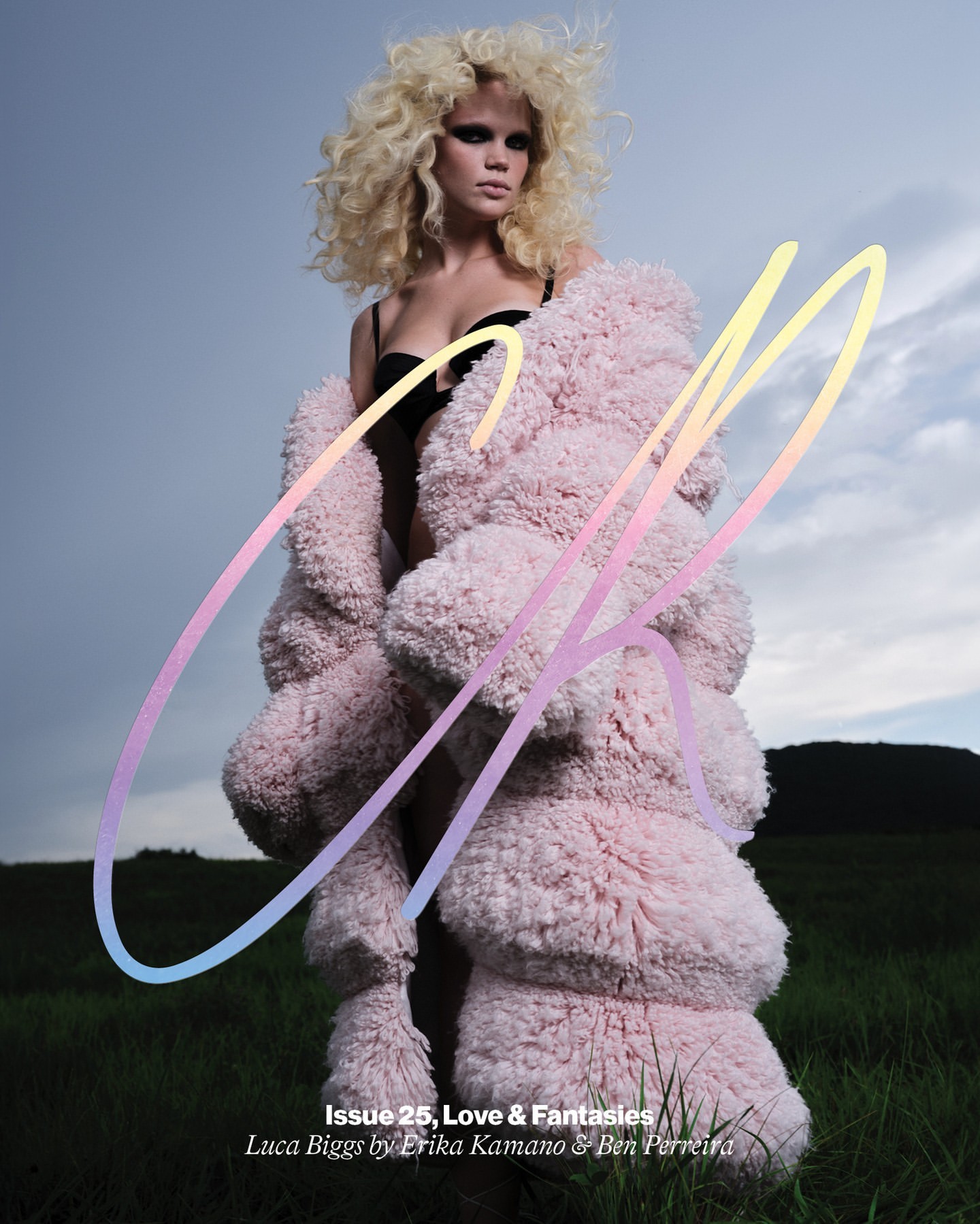 Fashion magazine cover with a woman wearing a fur coat in a grassy field under a cloudy sky with the magazine name written on the image.