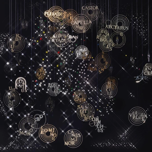 Art installation with celestial star maps, constellation names, and geometric starbursts suspended against a dark night sky background.