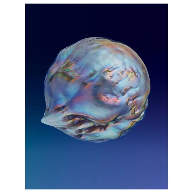 Iridescent sphere against a blue gradient backdrop. Smooth, textured surface catches the light with a range of shimmering colours and textures.