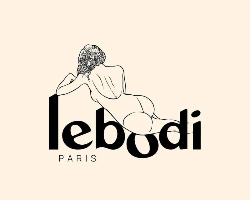 Line art illustration of nude female figure reclining beside bold sans-serif text 'lebodi PARIS' on a light peach backdrop.