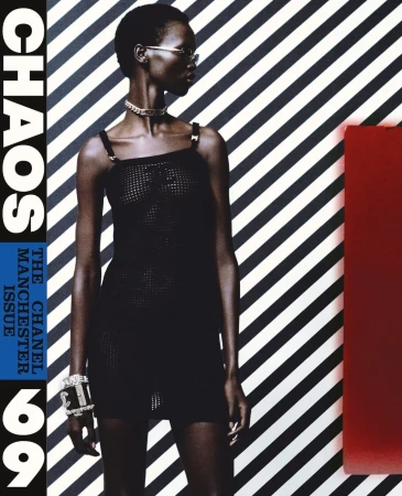 Fashion magazine cover featuring a Black female model in a black dress, accessorized with jewelry, against a striped background with text.