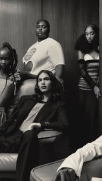 Group of four fashion models in a wood-paneled interior photographed by Ethan Hart in London.