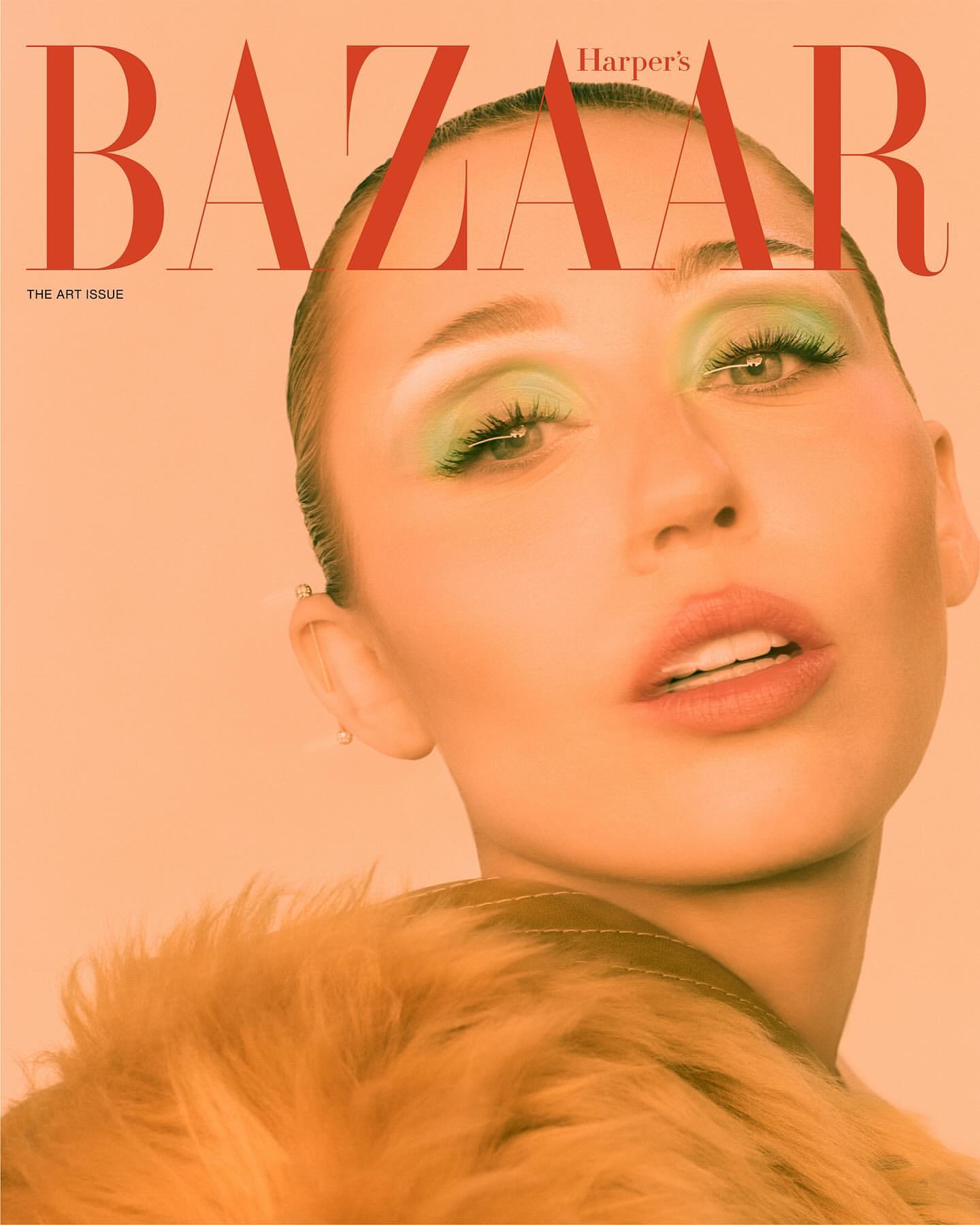 Harper's Bazaar magazine cover features a portrait of a woman with green eye makeup and a fur coat against a peach-colored background.