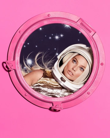 Blonde woman in a white astronaut helmet, seen through a pink round window, looks off to the right against a starry background.