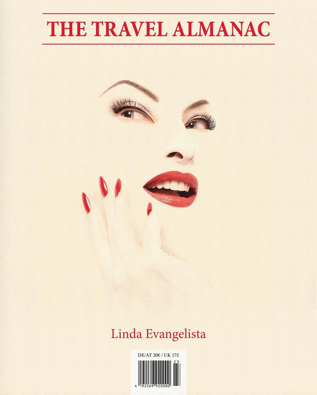 Book cover art featuring a woman's face with red lips and fingernails, titled 'The Travel Almanac' and crediting Linda Evangelista.