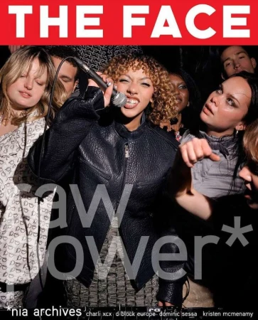Magazine cover featuring a singer with a microphone, surrounded by several other individuals in a dimly lit setting with red branding.