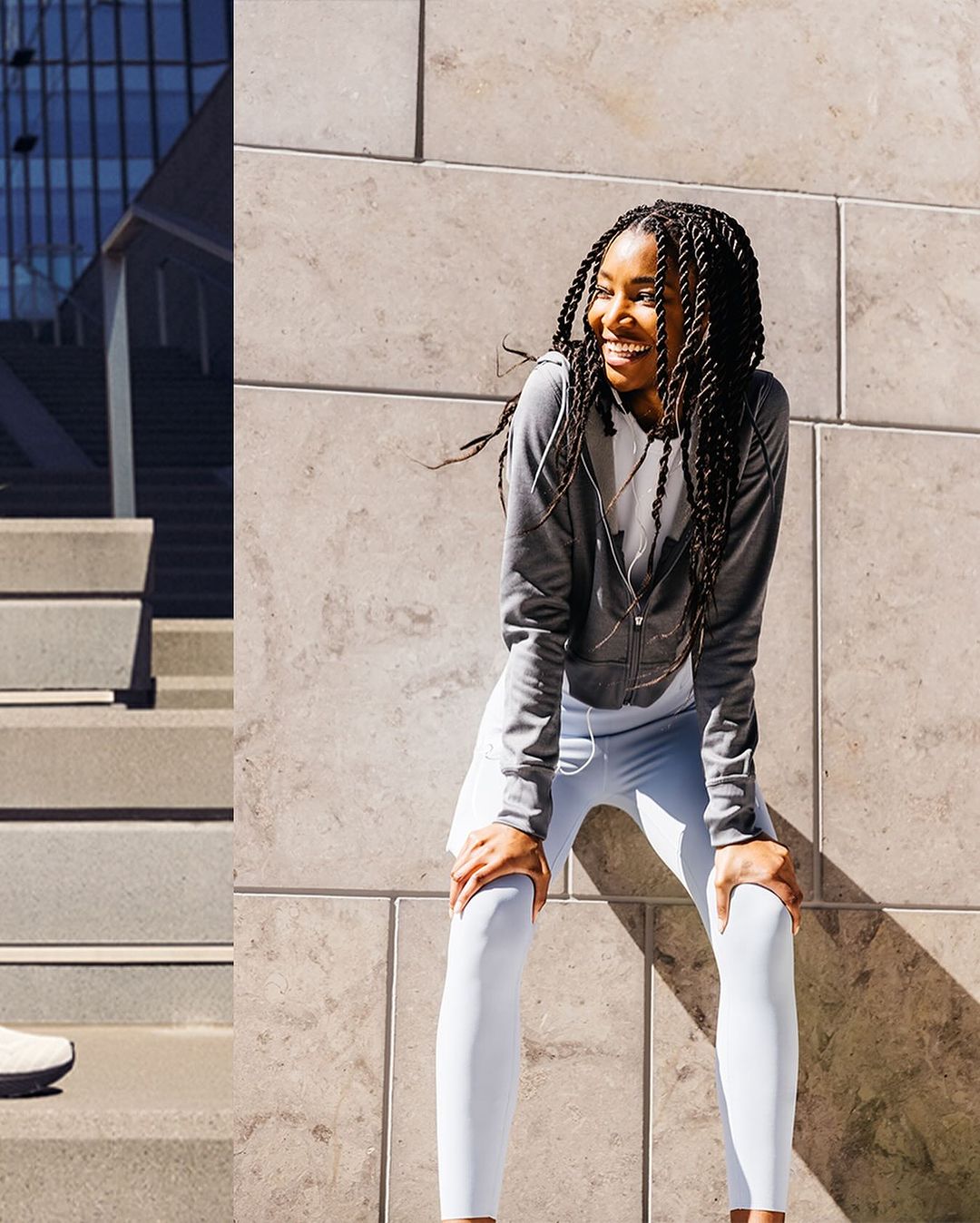 A smiling African American woman pauses from her outdoor fitness routine, wearing sporty white leggings and a gray sweatshirt, leaning forward.