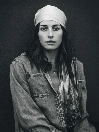 Portrait of a woman wearing a headscarf and denim jacket photographed by Fab Fernandez in New York