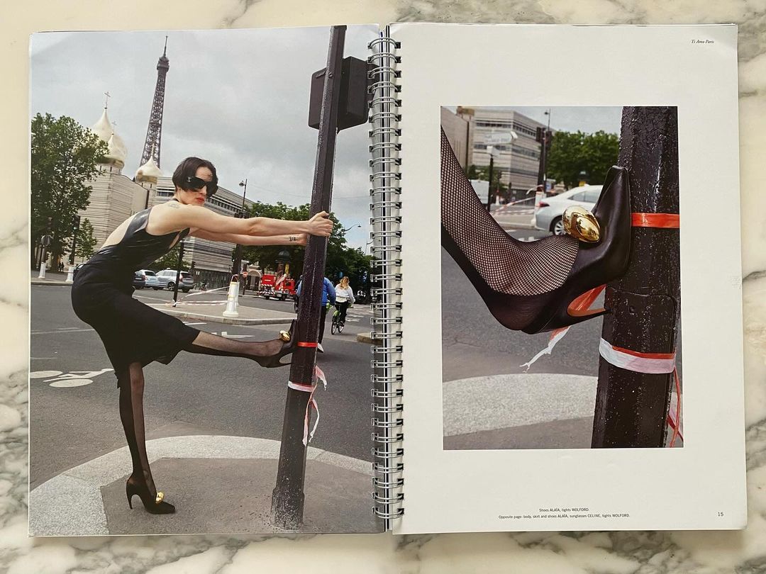 A woman in a black dress poses near a lamp post and the Eiffel Tower, while a separate close-up image shows a black high heel.