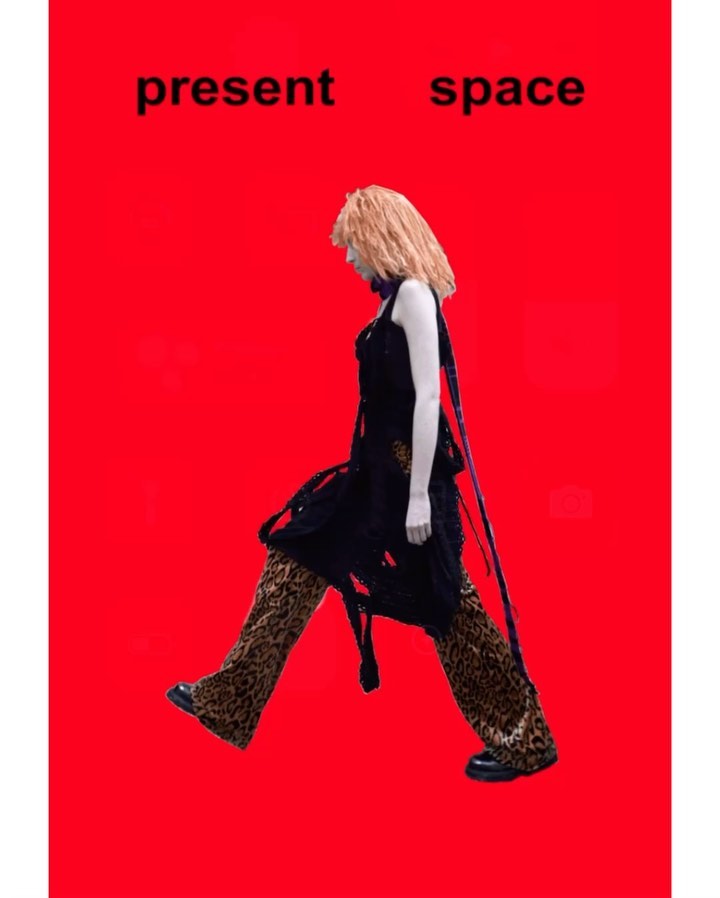 A woman with blonde hair walks against a red background. She is wearing a black top and leopard print pants. Above her, the text 'present space'.