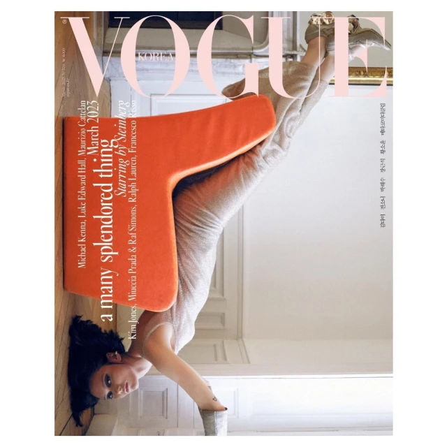 Vogue Korea cover featuring a woman striking a headstand yoga pose in a shimmering dress, positioned beneath an orange T-shaped object.
