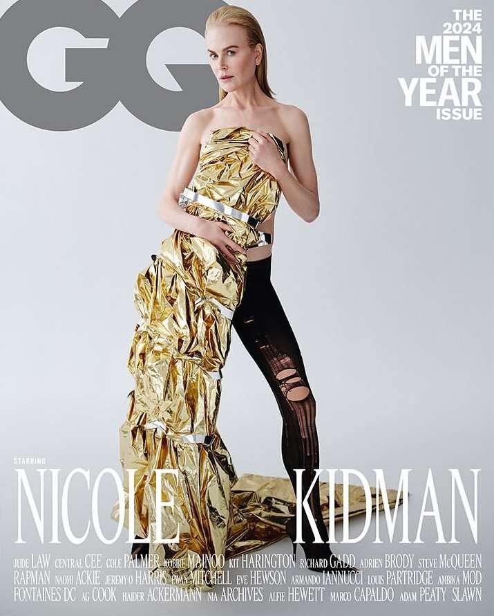 Nicole Kidman on GQ cover wearing gold wrapping, black leggings, standing indoors. Magazine features celebrity, fashion photography.