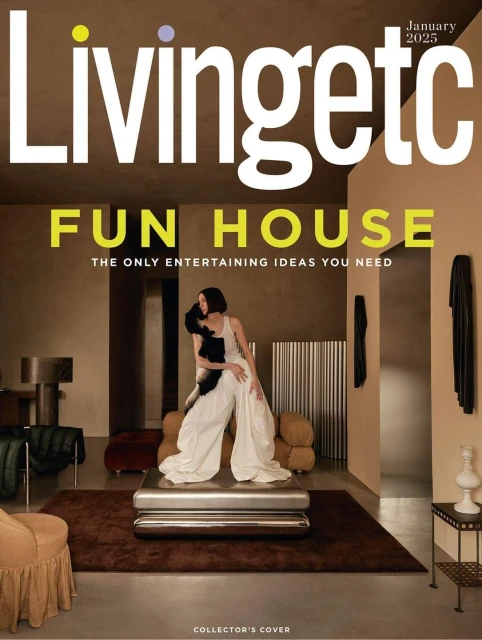 Magazine cover featuring a woman in wide-leg pants sitting on a coffee table, with interior design elements and neutral color palette.