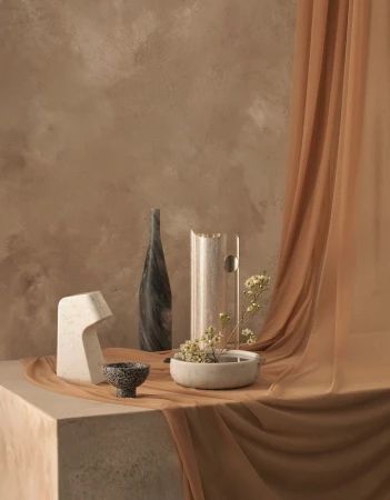 Still life composition featuring vases, bowls, and fabric drapery in neutral tones, creating a serene and elegant display.