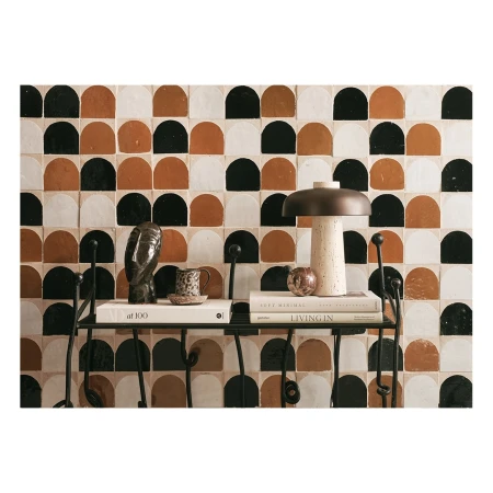 Still life featuring a mushroom lamp, books, an owl figurine, and a patterned tile backdrop. The composition evokes a cozy, artistic ambiance.