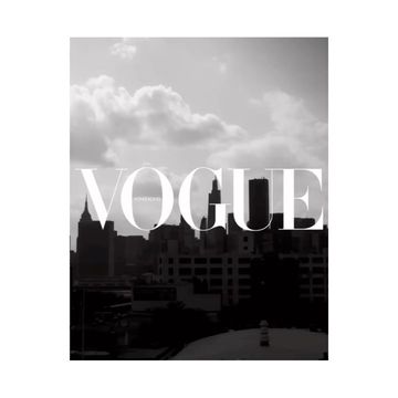 Black and white cityscape with high-rise buildings under a cloudy sky, featuring the word 'Vogue' overlaid on the image.