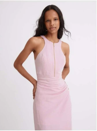 Model in pink halterneck midi dress with a front zipper posing against a plain neutral background
