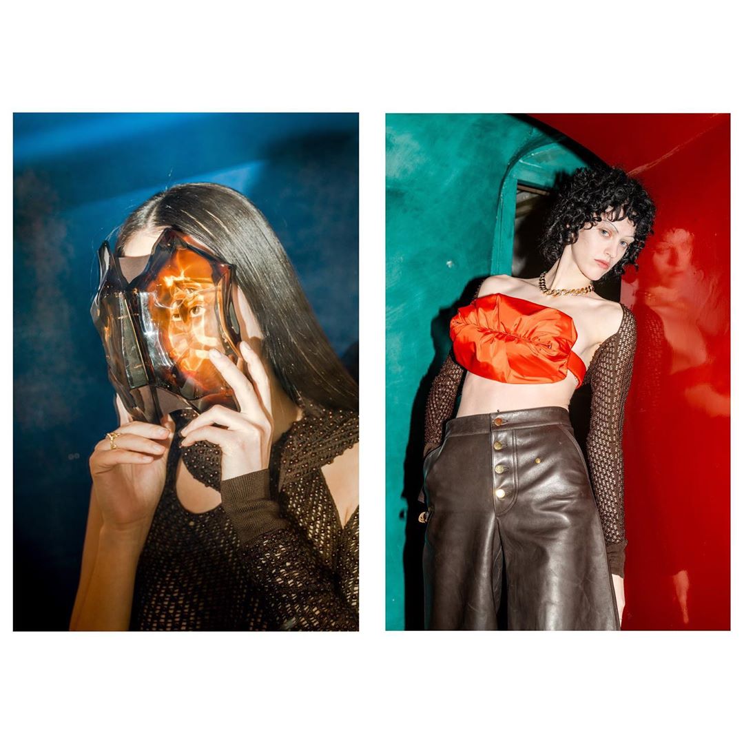 Split-screen fashion shot: woman in futuristic mask, woman in leather culottes and orange top against colored wall. Studio lit.