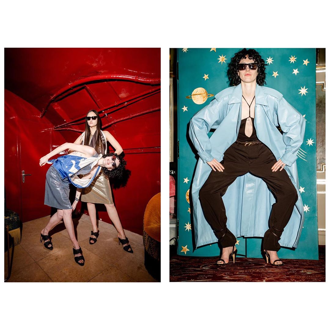 Two women model retro-style fashions in a photograph featuring a red interior scene and a blue backdrop with celestial patterns.