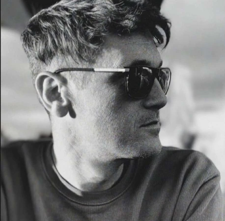 Black and white portrait of a man in dark sunglasses and a dark t shirt looking to the side in New York