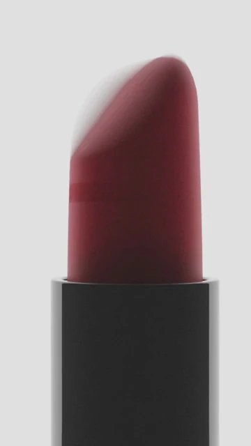 Close-up of a red lipstick bullet against a solid grey background, cosmetic product with a smooth texture and reflective surface.