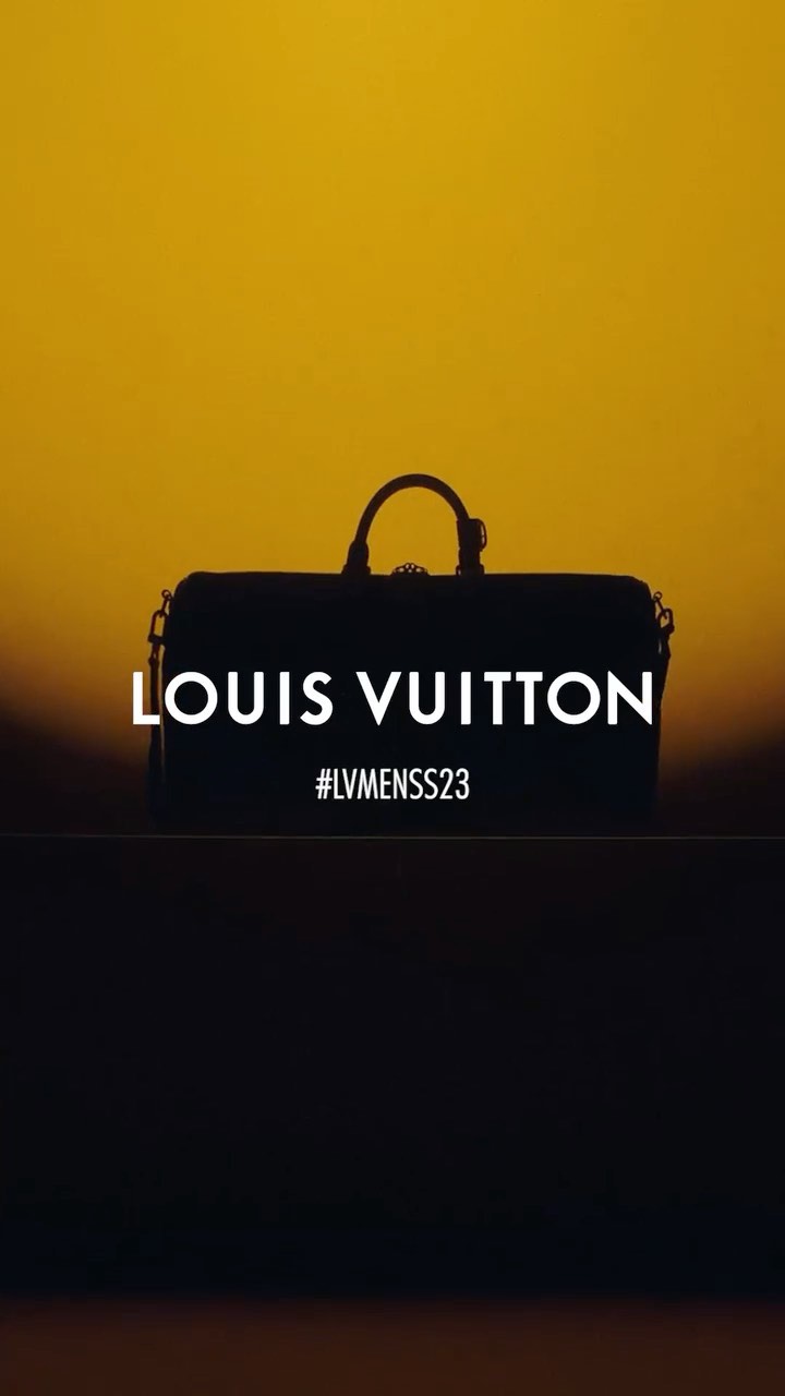 Silhouette of a Louis Vuitton duffel bag against a golden sky, featuring the brand name and #LVMENSS23 in a minimalist composition.